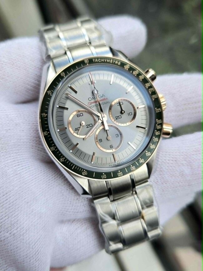 Omega Speedmaster Tokyo 2020 Green, Sedna Gold & Stainless Steel, Reference 522.20.42.30.06.001, Year 2022, New Old Stock Condition, Full Set Box & Papers, Balance of Omega 5 Year Factory Warranty. Never Worn with Full Factory Stickers.